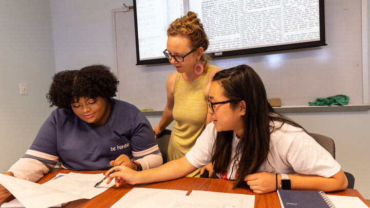 Katrina Jagodinsky, associate professor of history, advises two undergraduate researchers on a research project in the Center for Digital Research in the Humanities.