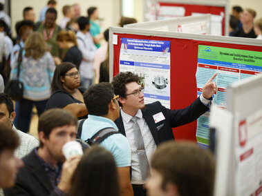 Student presenting research at the Nebraska Summer Research Symposium