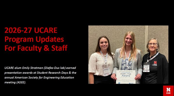 Video advertisement, red text on a black background. Depicts the first slide of the 2026-27 UCARE Program Updates for Faculty & Staff presentation. A photo of Professor Diefes-Dux and two smiling students holding a best paper award certificate is included.