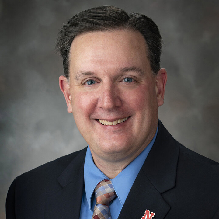 Professor Brett White smiles in this headshot photo.